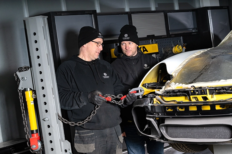 Colour-matching and refinishing car panel in Colourcube bodyshop